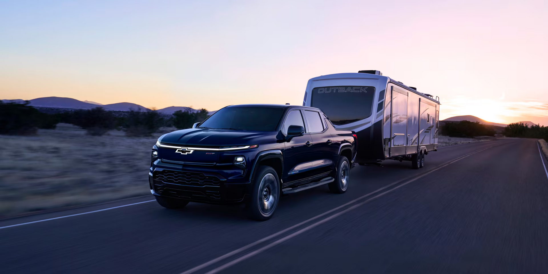 2025 Chevy Silverado 1500 hauling a camper