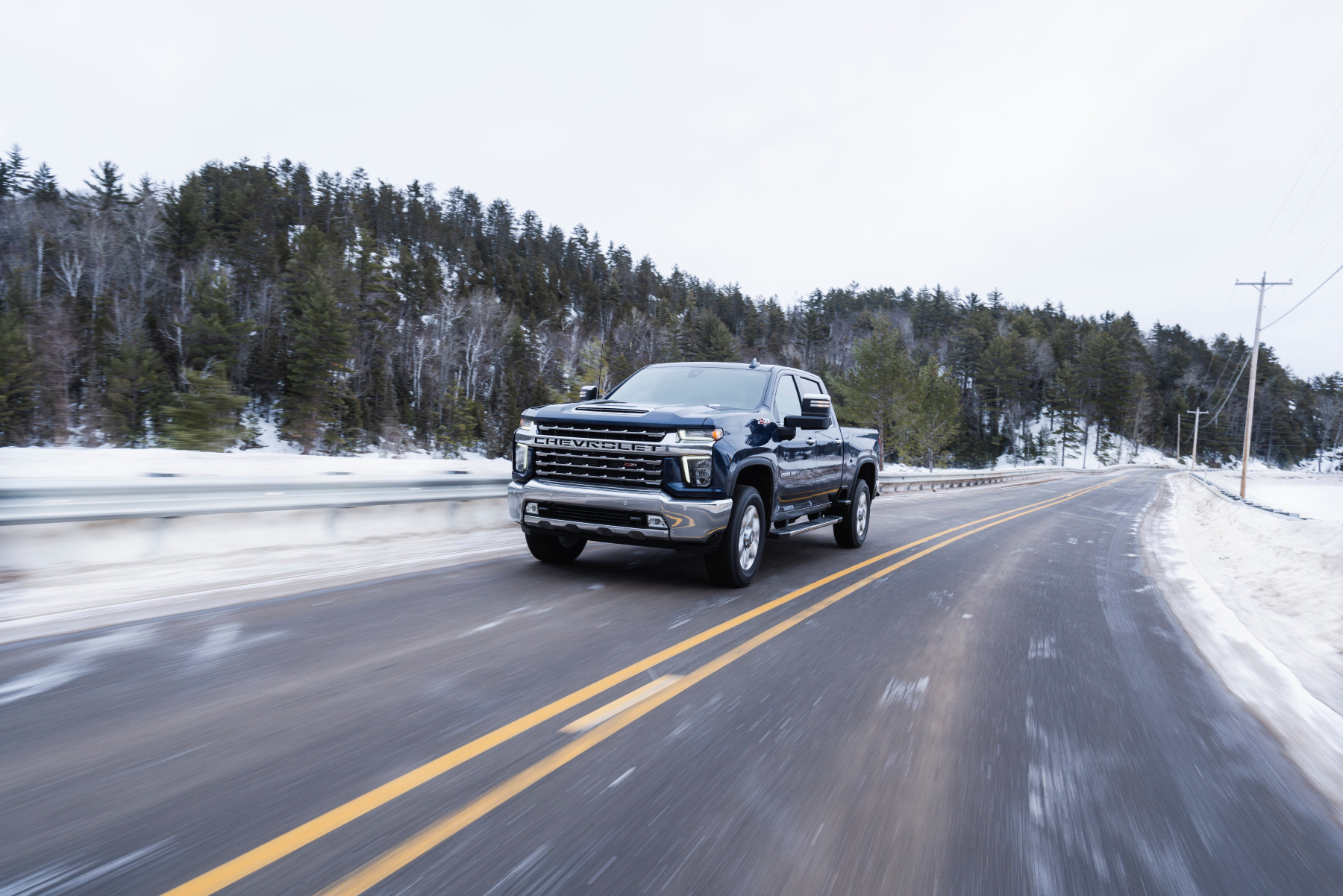 Chevrolet Silverado truck driving in winter conditions