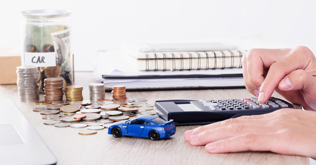 Person calculating financing rates for a new car